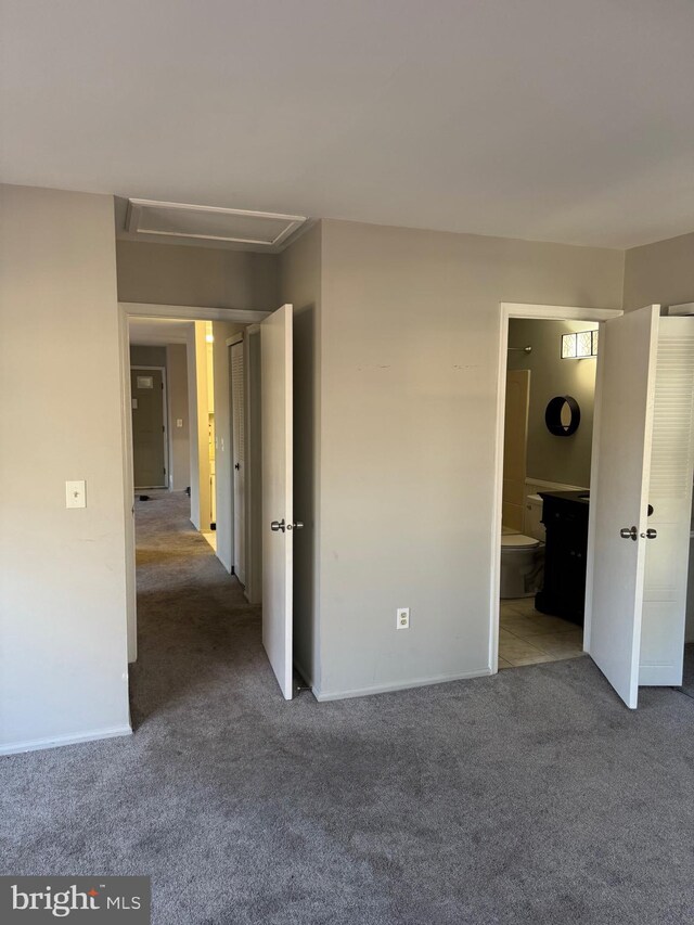 126 Club Pl Unit 126, Absecon, NJ 08205 - unfurnished bedroom featuring carpet, attic access, baseboards, and connected bathroom