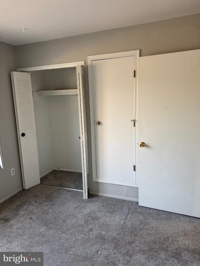 126 Club Pl Unit 126, Absecon, NJ 08205 - unfurnished bedroom featuring carpet flooring and a closet