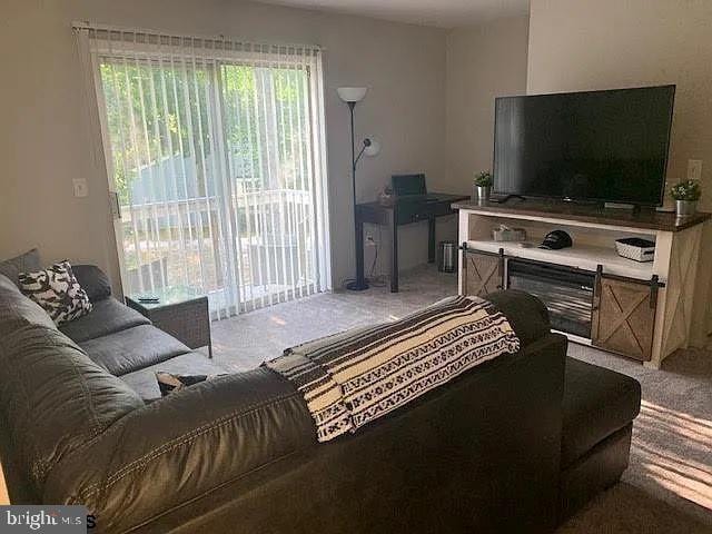 126 Club Pl Unit 126, Absecon, NJ 08205 - living room with carpet