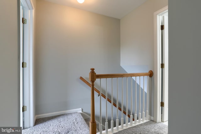staircase with carpet flooring and baseboards