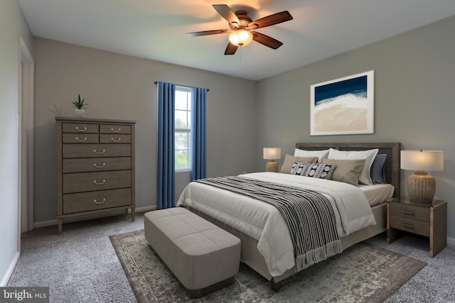 carpeted bedroom featuring baseboards and a ceiling fan