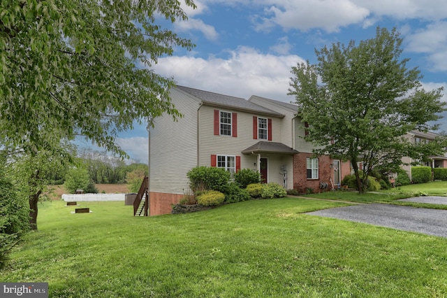 traditional home with a front lawn