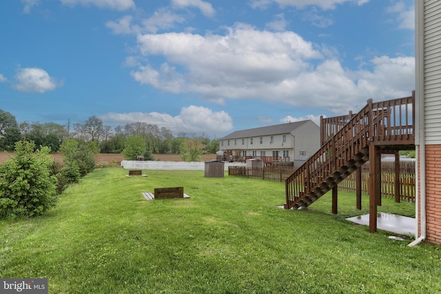 view of yard featuring stairway, a patio area, and a deck
