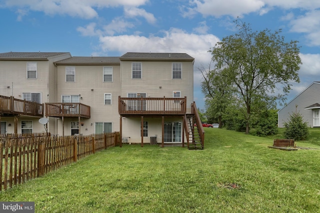 rear view of property with stairs and a wooden deck