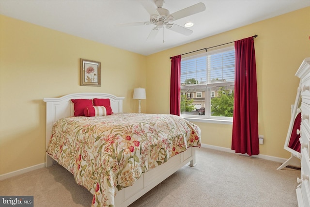 bedroom featuring carpet flooring, baseboards, and ceiling fan