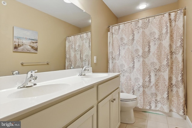 full bathroom with toilet, tile patterned floors, double vanity, and a shower with curtain