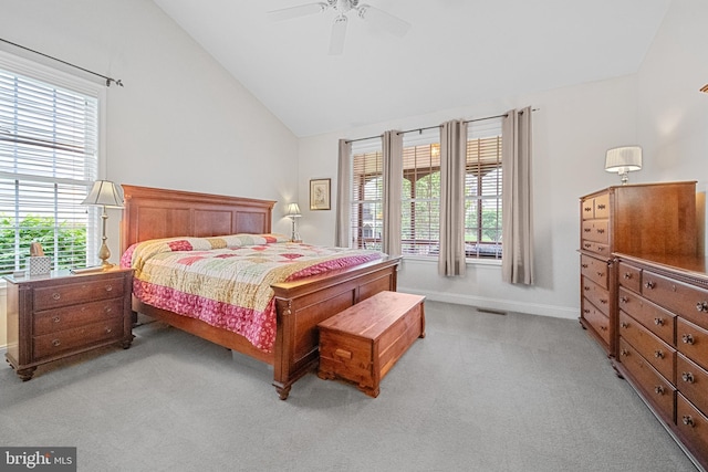 6051 Piney Grove Way, Gainesville, VA 20155 - bedroom with light colored carpet, lofted ceiling, multiple windows, baseboards, and ceiling fan