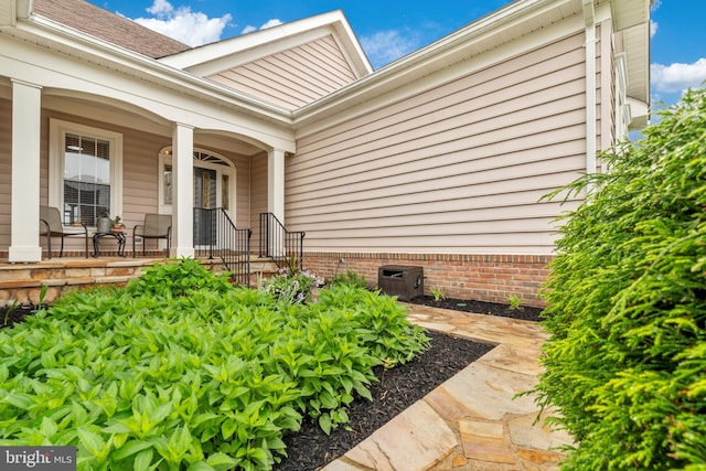 6051 Piney Grove Way, Gainesville, VA 20155 - entrance to property featuring a porch and central air condition unit