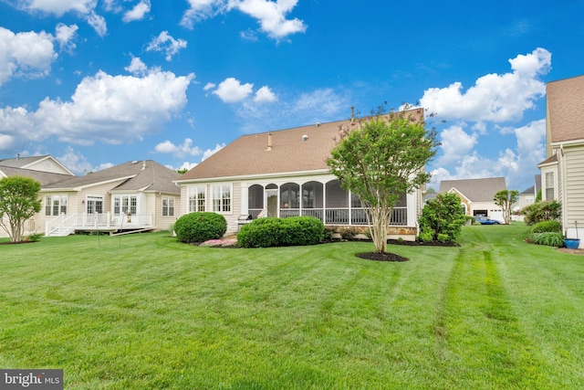 6051 Piney Grove Way, Gainesville, VA 20155 - rear view of property featuring a sunroom, a yard, and a deck