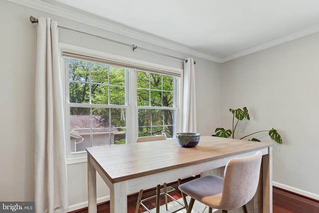 6311 Gentele Ct, Alexandria, VA 22310 - dining room featuring baseboards, ornamental molding, and dark wood-type flooring