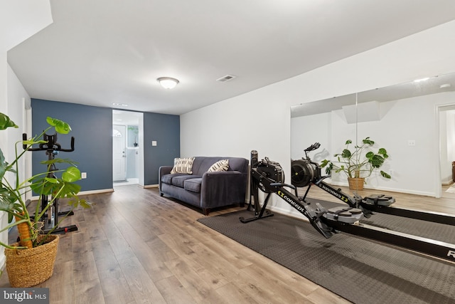 6311 Gentele Ct, Alexandria, VA 22310 - workout area featuring wood finished floors and baseboards