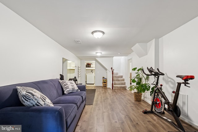 6311 Gentele Ct, Alexandria, VA 22310 - living room with washer / clothes dryer, stairs, and wood finished floors