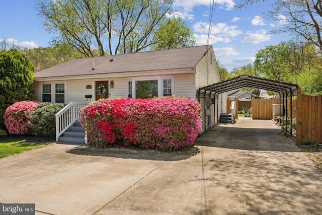 6311 Gentele Ct, Alexandria, VA 22310 - view of front of property with a detached carport, fence, driveway, and roof with shingles