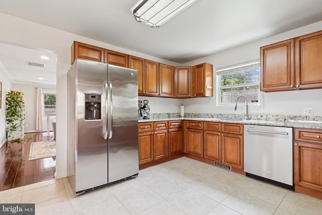 6311 Gentele Ct, Alexandria, VA 22310 - kitchen with appliances with stainless steel finishes, brown cabinets, plenty of natural light, and recessed lighting