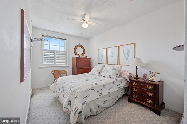 bedroom featuring carpet, baseboards, and ceiling fan