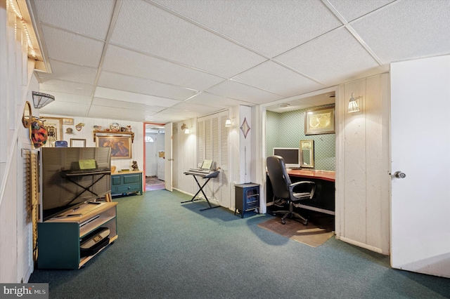 office with a paneled ceiling and carpet