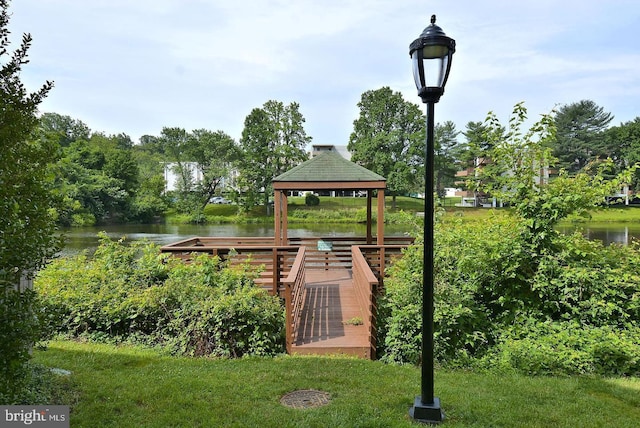view of property's community featuring a gazebo and a water view