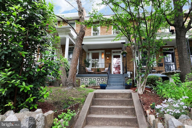 2420 2nd St NE, Washington, DC 20002 - view of front of house with brick siding, covered porch, and stairs