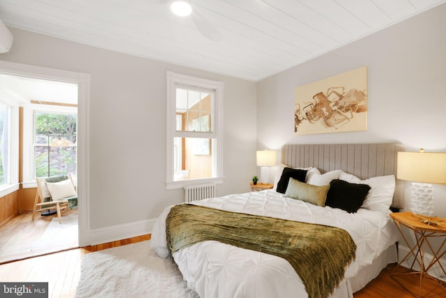 2420 2nd St NE, Washington, DC 20002 - bedroom with radiator, wood finished floors, and baseboards