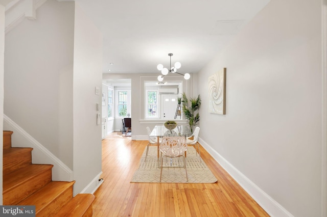 2420 2nd St NE, Washington, DC 20002 - dining room with stairway, a wall mounted air conditioner, baseboards, and hardwood / wood-style flooring