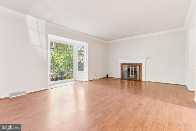 1509 Carlyle Dr Unit 152, Crofton, MD 21114 - unfurnished living room with wood finished floors, ornamental molding, a fireplace, and baseboards