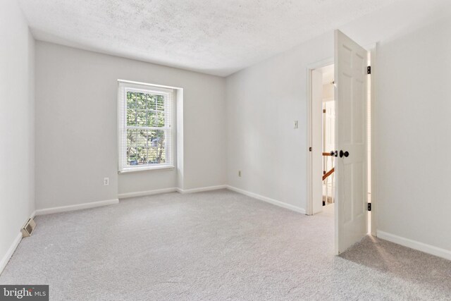 1509 Carlyle Dr Unit 152, Crofton, MD 21114 - empty room with carpet, a textured ceiling, and baseboards