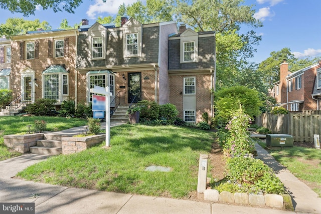 1509 Carlyle Dr Unit 152, Crofton, MD 21114 - view of front of house featuring brick siding, mansard roof, and roof with shingles
