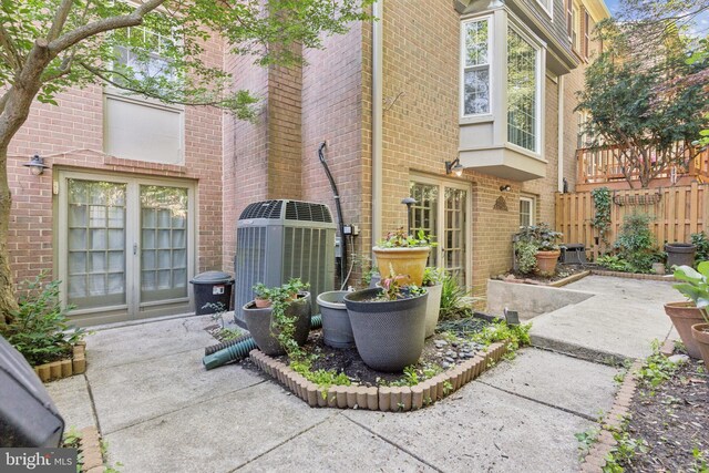 1509 Carlyle Dr Unit 152, Crofton, MD 21114 - back of property with brick siding, central AC, and a patio