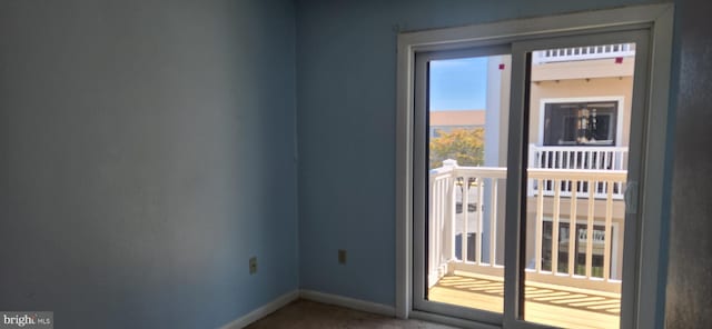 149 Captains Quarters Rd Unit 20102, Ocean City, MD 21842 - doorway to outside with baseboards and carpet floors