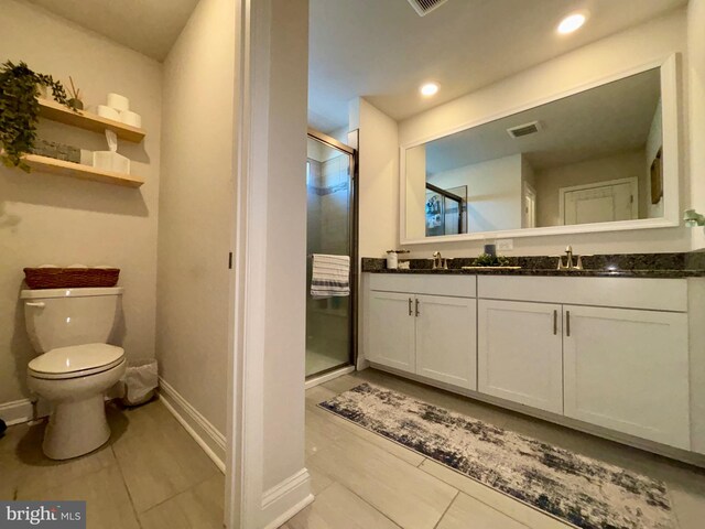 35342 Wright Way, Millsboro, DE 19966 - bathroom featuring a stall shower, toilet, double vanity, baseboards, and recessed lighting