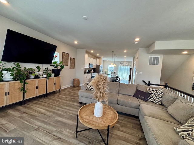 35342 Wright Way, Millsboro, DE 19966 - living room with light wood-style flooring, recessed lighting, and baseboards