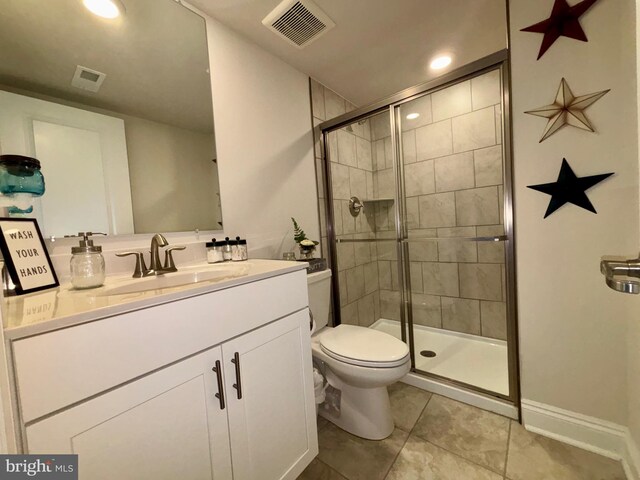35342 Wright Way, Millsboro, DE 19966 - bathroom featuring tile patterned flooring, a stall shower, toilet, vanity, and recessed lighting