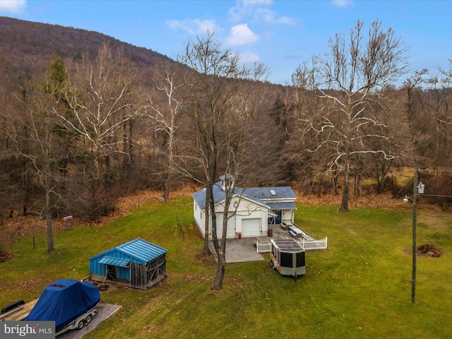 aerial view of property and surrounding area with a mountainous background