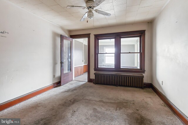 6350 Belle Ave, Lewistown, PA 17044 - carpeted empty room featuring radiator heating unit, ceiling fan, and baseboards