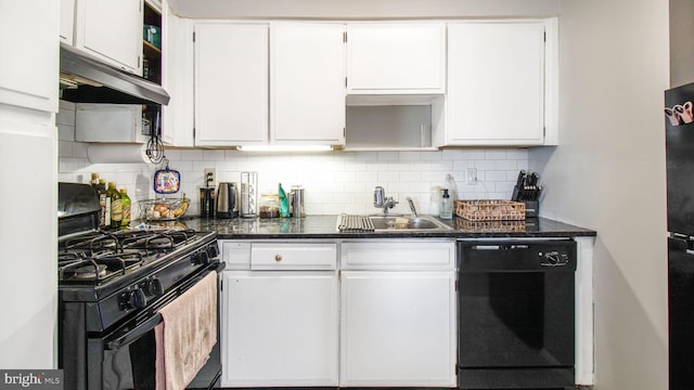 kitchen with black appliances, under cabinet range hood, a sink, and white cabinets