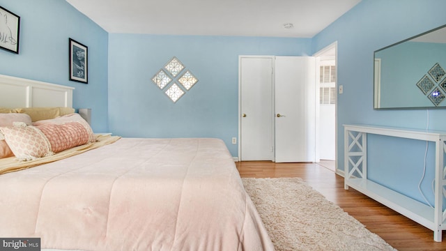 bedroom with wood finished floors