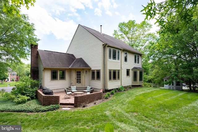 15069 Brown Post Ln, Centreville, VA 20121 - back of house with a chimney, a lawn, a patio, and outdoor lounge area