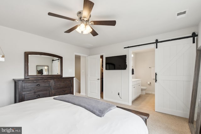 16 Foundry Blvd, Mount Holly, NJ 08060 - bedroom featuring a barn door, light carpet, ensuite bathroom, baseboards, and a ceiling fan