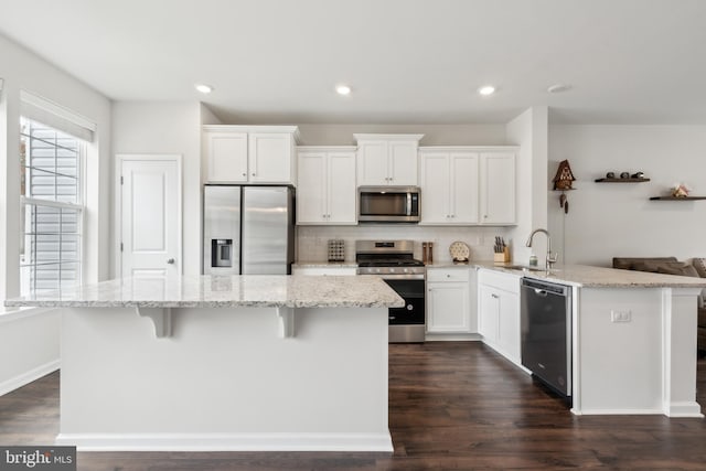 16 Foundry Blvd, Mount Holly, NJ 08060 - kitchen with appliances with stainless steel finishes, a sink, white cabinetry, dark wood-style floors, and backsplash