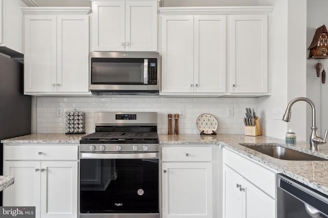16 Foundry Blvd, Mount Holly, NJ 08060 - kitchen with stainless steel appliances, a sink, and white cabinetry