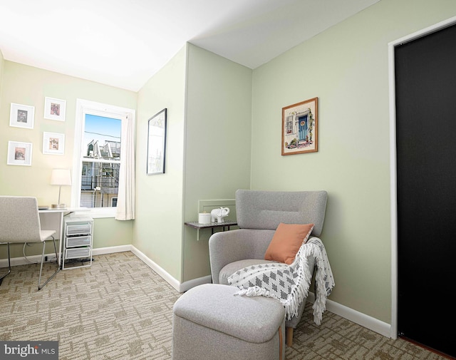 3211 Leverton Ave, Baltimore, MD 21224 - living area with baseboards, carpet floors, and a desk