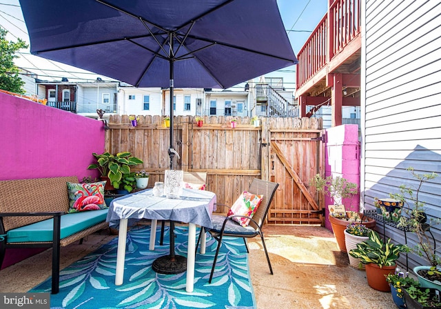 3211 Leverton Ave, Baltimore, MD 21224 - view of patio / terrace featuring a gate, fence, and outdoor dining area