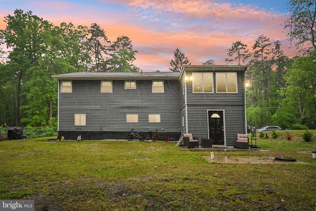 184 Chatham St, Pemberton, NJ 08015 - back of house at dusk featuring a yard and a patio area