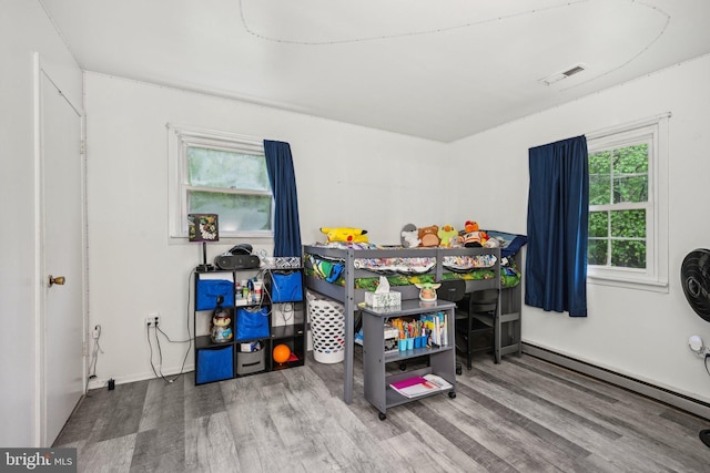 184 Chatham St, Pemberton, NJ 08015 - bedroom with wood finished floors and a baseboard radiator