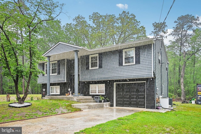 184 Chatham St, Pemberton, NJ 08015 - raised ranch featuring a garage, concrete driveway, and a front lawn