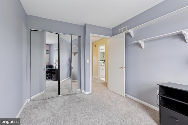 bedroom featuring carpet flooring and baseboards