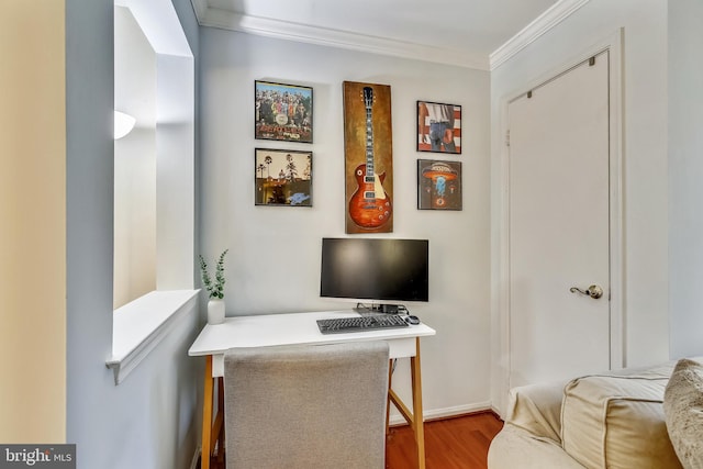 office area featuring ornamental molding, wood finished floors, and baseboards
