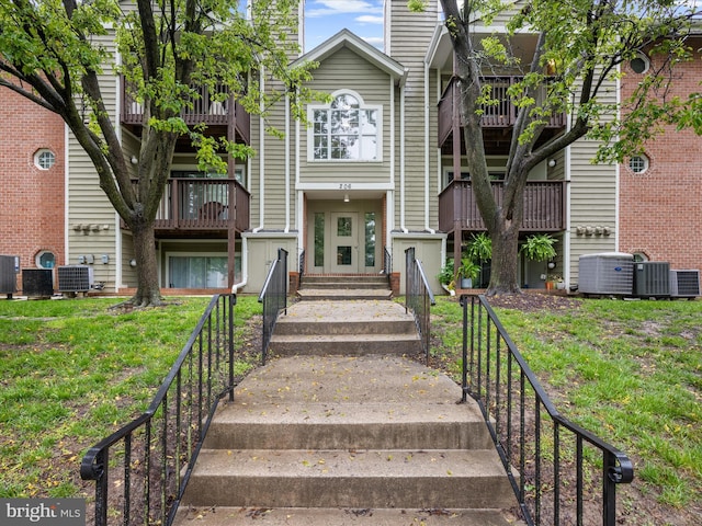 206 Water Fountain Ct Unit 201, Glen Burnie, MD 21060 - view of building exterior with central AC and entry steps