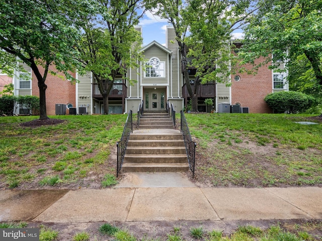 206 Water Fountain Ct Unit 201, Glen Burnie, MD 21060 - townhome / multi-family property featuring a chimney, central AC unit, and french doors