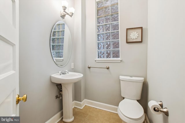 1314 Wallach Pl NW, Washington, DC 20009 - half bath featuring toilet, baseboards, a sink, and tile patterned floors